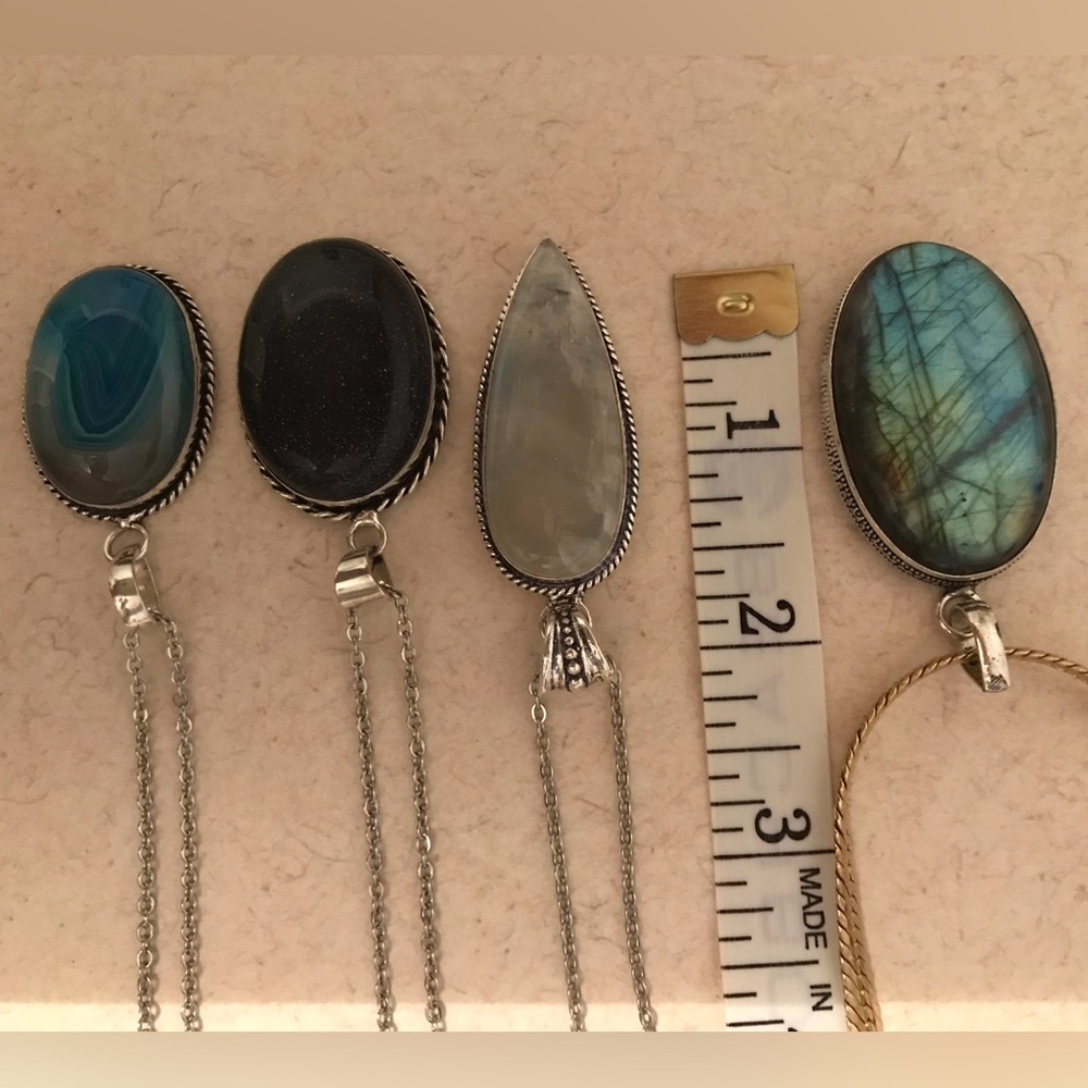 4 Pendants With Chains Included.